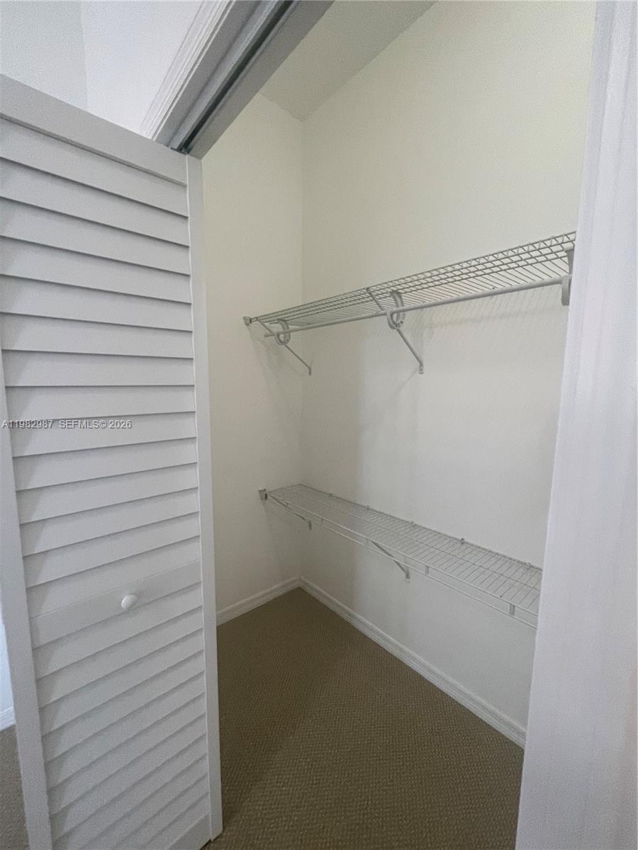 3421 Southwest 25th Street, Unit 1 Miami, FL 33133 - Photo 29 of 41 a view of a room with shelf