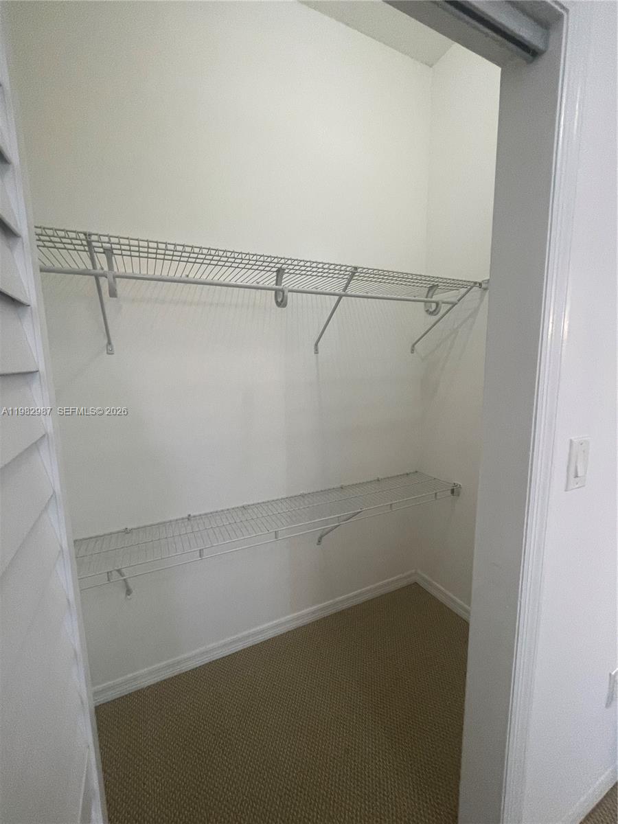 3421 Southwest 25th Street, Unit 1 Miami, FL 33133 - Photo 30 of 41 a view of a room with racks on the wall