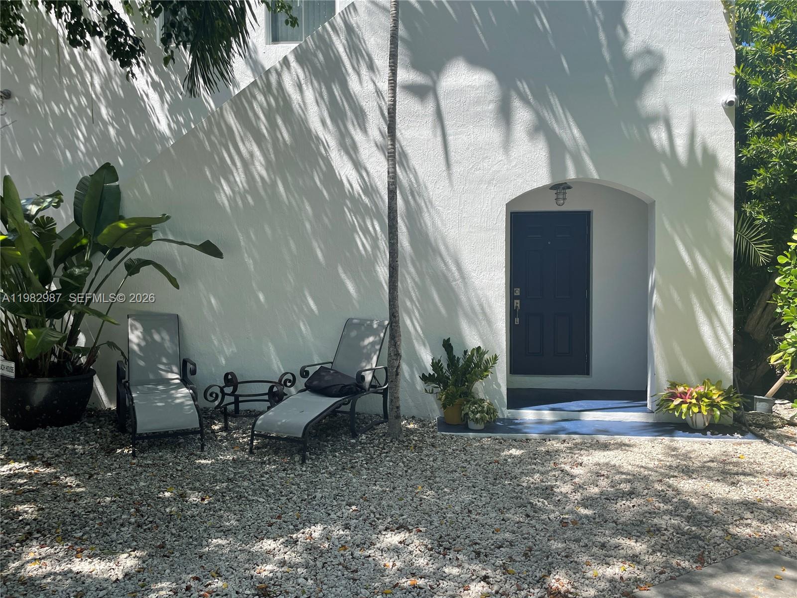 3421 Southwest 25th Street, Unit 1 Miami, FL 33133 - Photo 3 of 41 a view of backyard with outdoor seating and plants