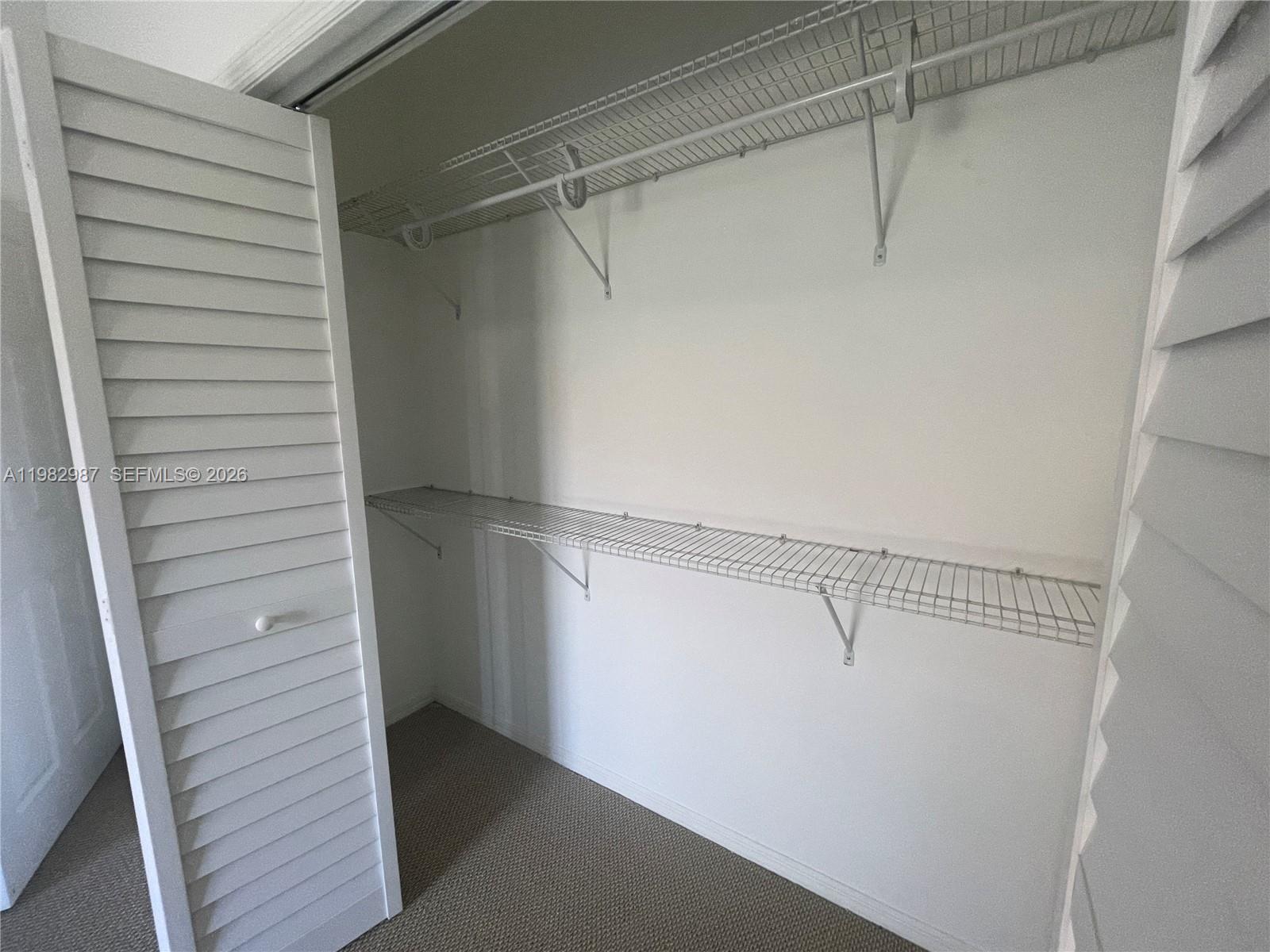 3421 Southwest 25th Street, Unit 1 Miami, FL 33133 - Photo 33 of 41 a view of an empty walk in closet