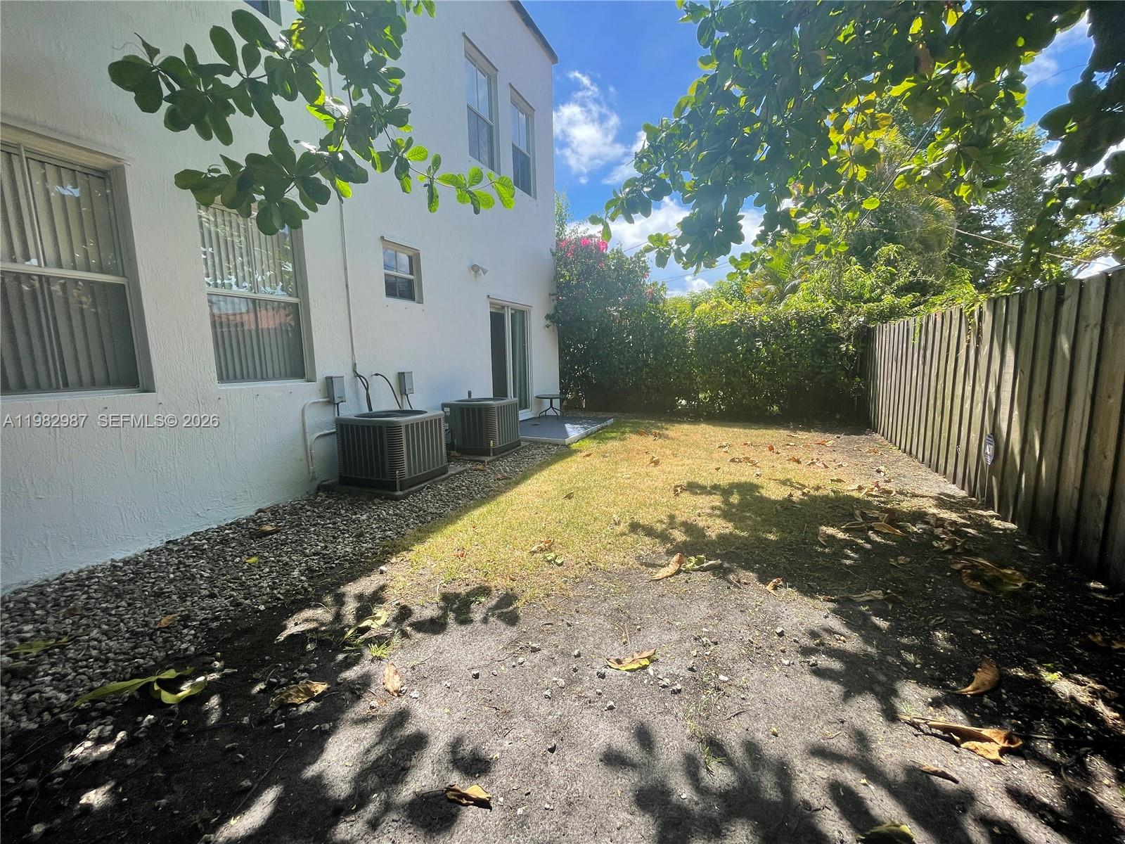 3421 Southwest 25th Street, Unit 1 Miami, FL 33133 - Photo 38 of 41 a front view of a house with a yard