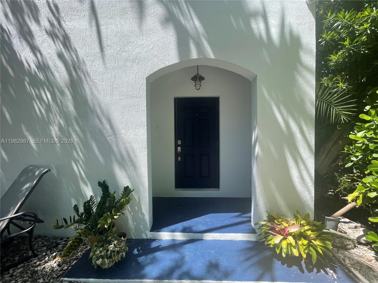 3421 Southwest 25th Street, Unit 1 Miami, FL 33133 - Photo 4 of 41 a front view of a house with a garden