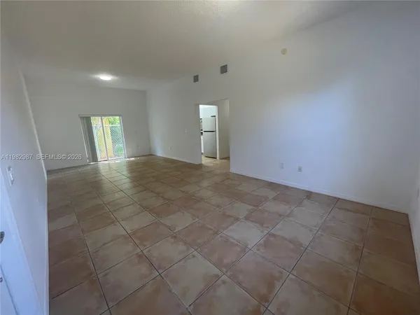 a view of an empty room and window