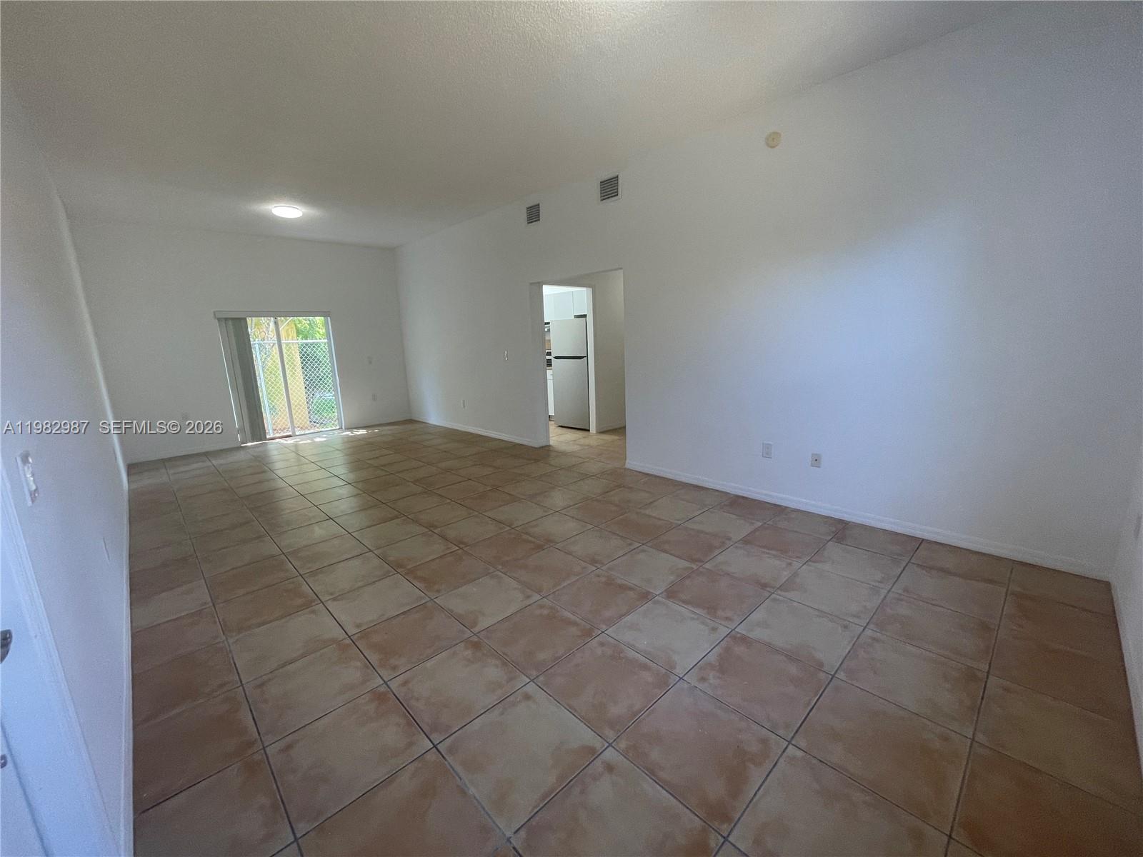 3421 Southwest 25th Street, Unit 1 Miami, FL 33133 - Photo 7 of 41 a view of an empty room and window