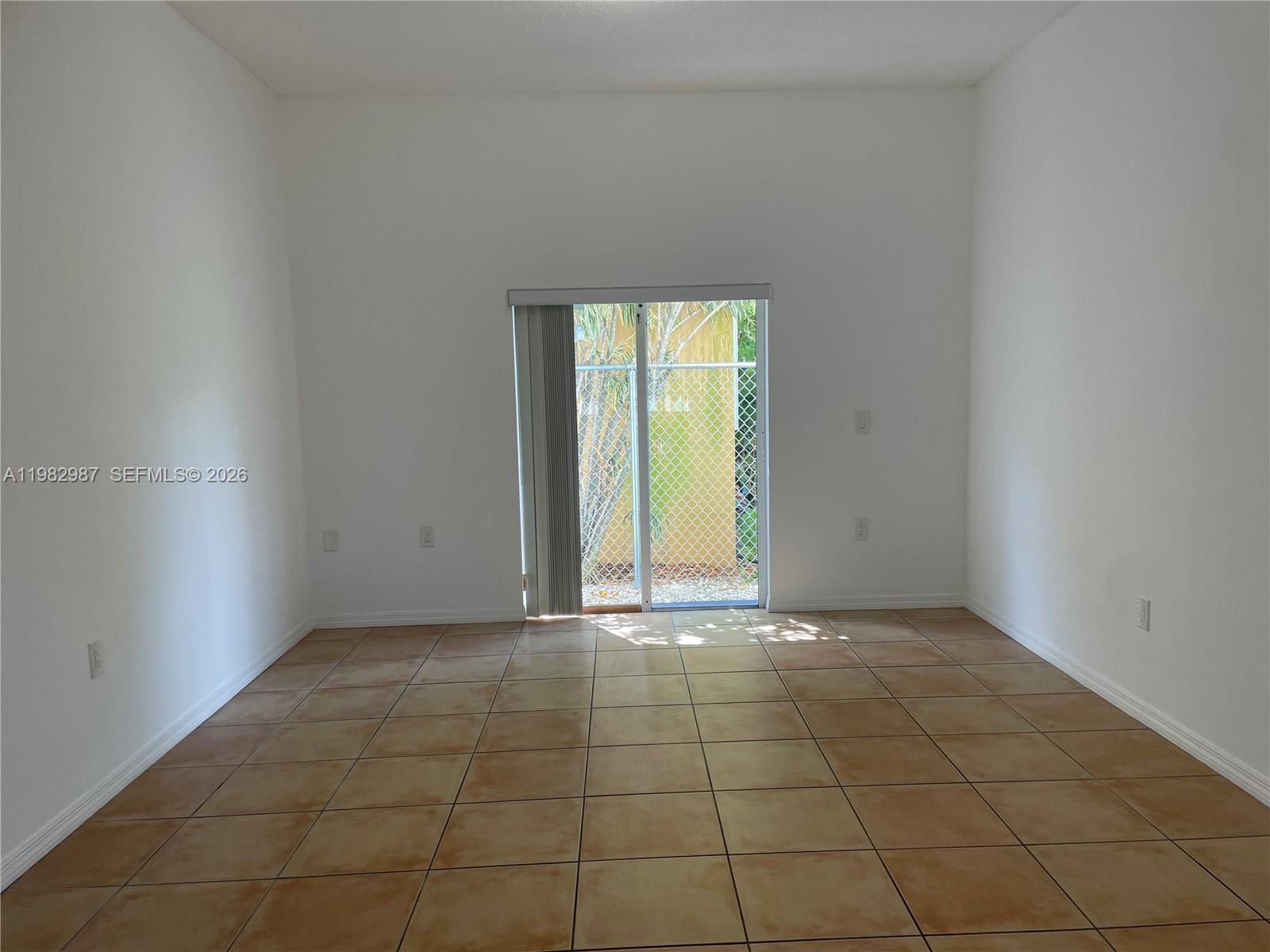 3421 Southwest 25th Street, Unit 1 Miami, FL 33133 - Photo 8 of 41 a view of an empty room with a window