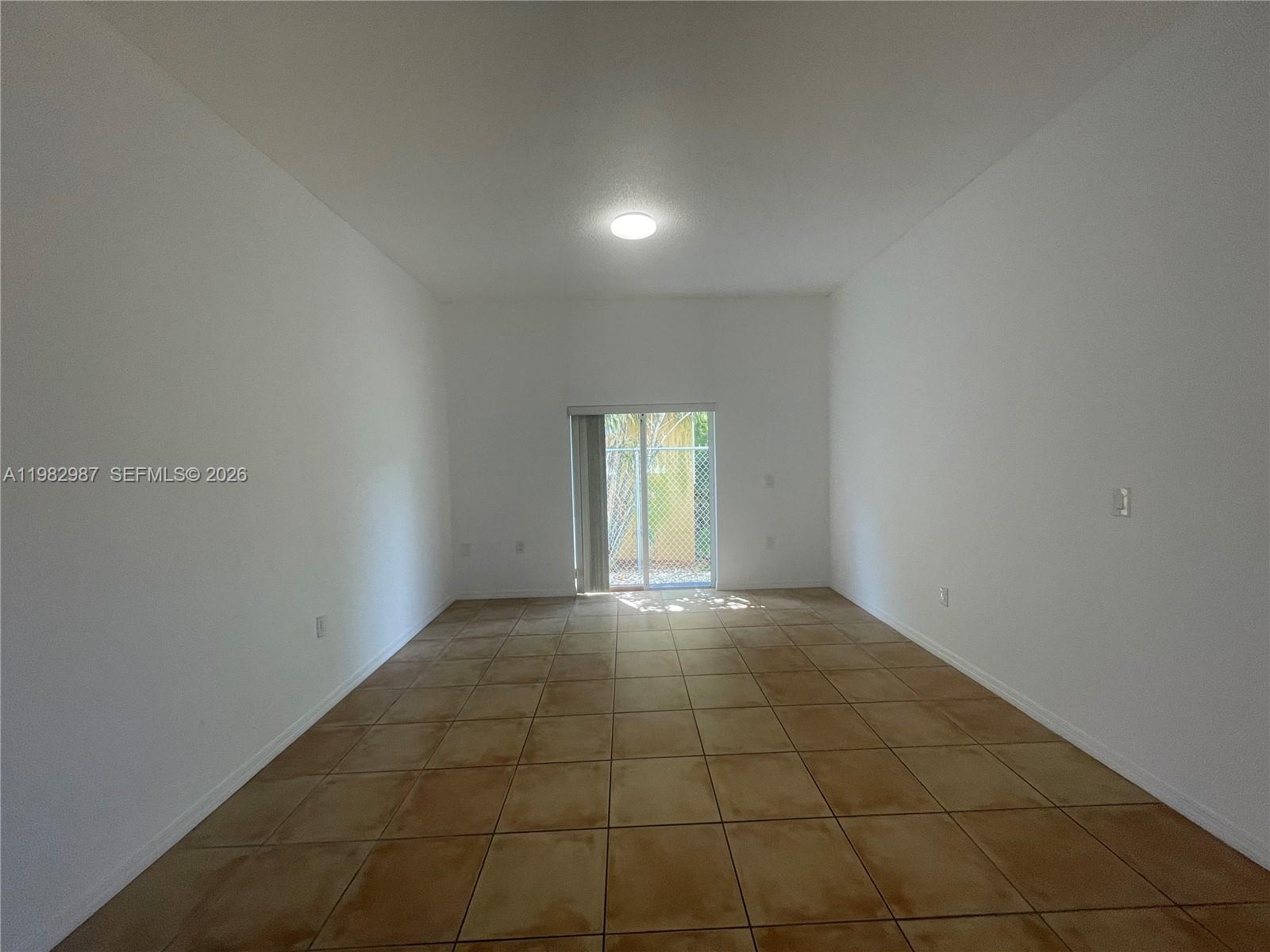 3421 Southwest 25th Street, Unit 1 Miami, FL 33133 - Photo 9 of 41 a view of an empty room and window