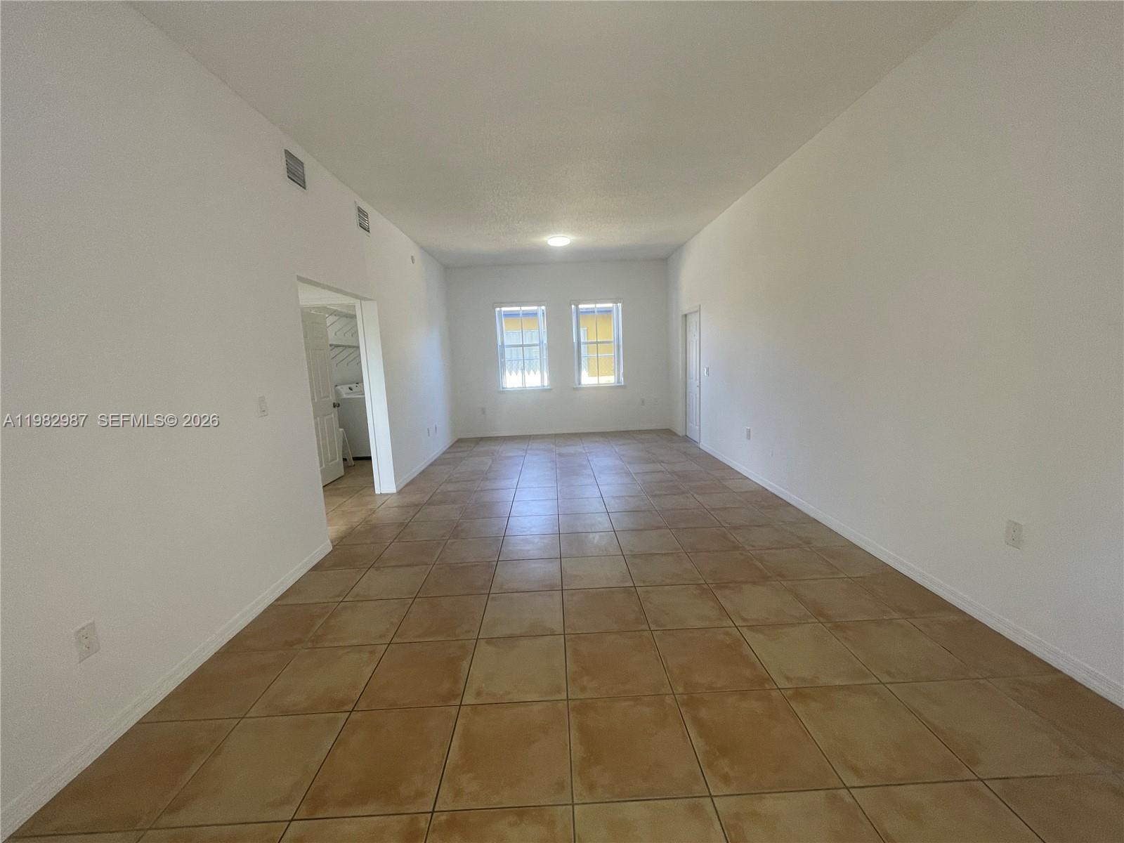 3421 Southwest 25th Street, Unit 1 Miami, FL 33133 - Photo 10 of 41 a view of hallway with windows