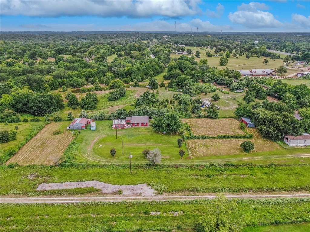 14452 Old Hearne Road Bryan, TX 77807 - Photo 16 of 17 an aerial view of residential houses with outdoor space and trees