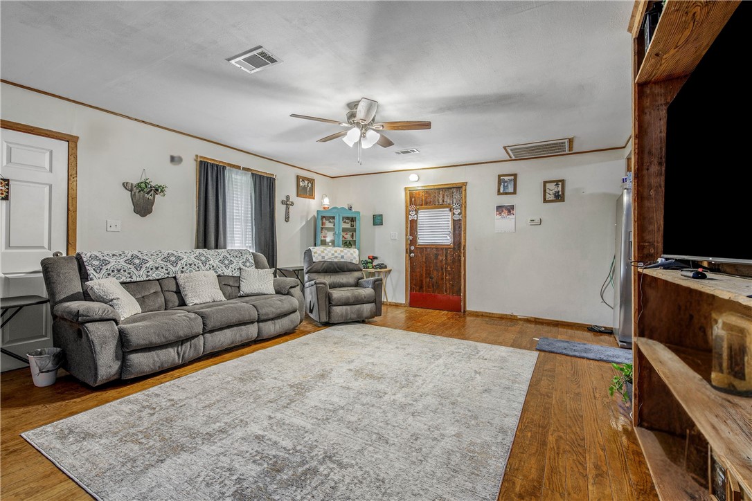 14452 Old Hearne Road Bryan, TX 77807 - Photo 5 of 17 a living room with furniture and a flat screen tv