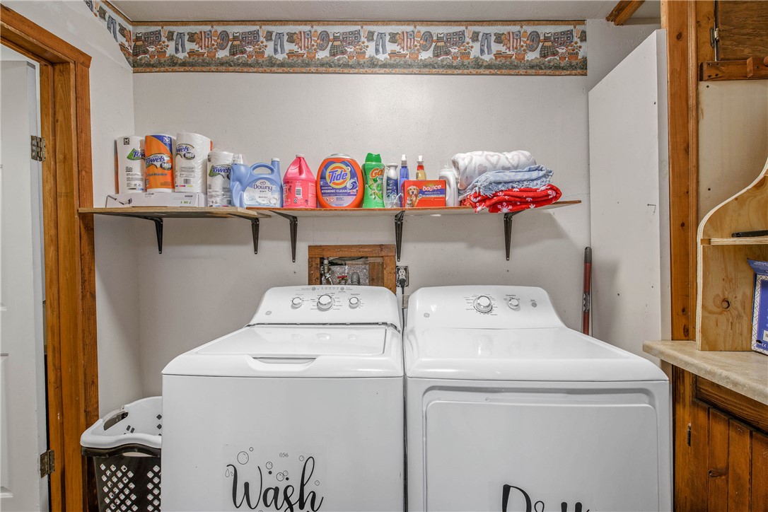 14452 Old Hearne Road Bryan, TX 77807 - Photo 8 of 17 a utility room with dryer and washer