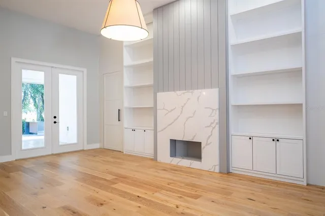 a kitchen with stainless steel appliances kitchen island granite countertop a refrigerator and a sink