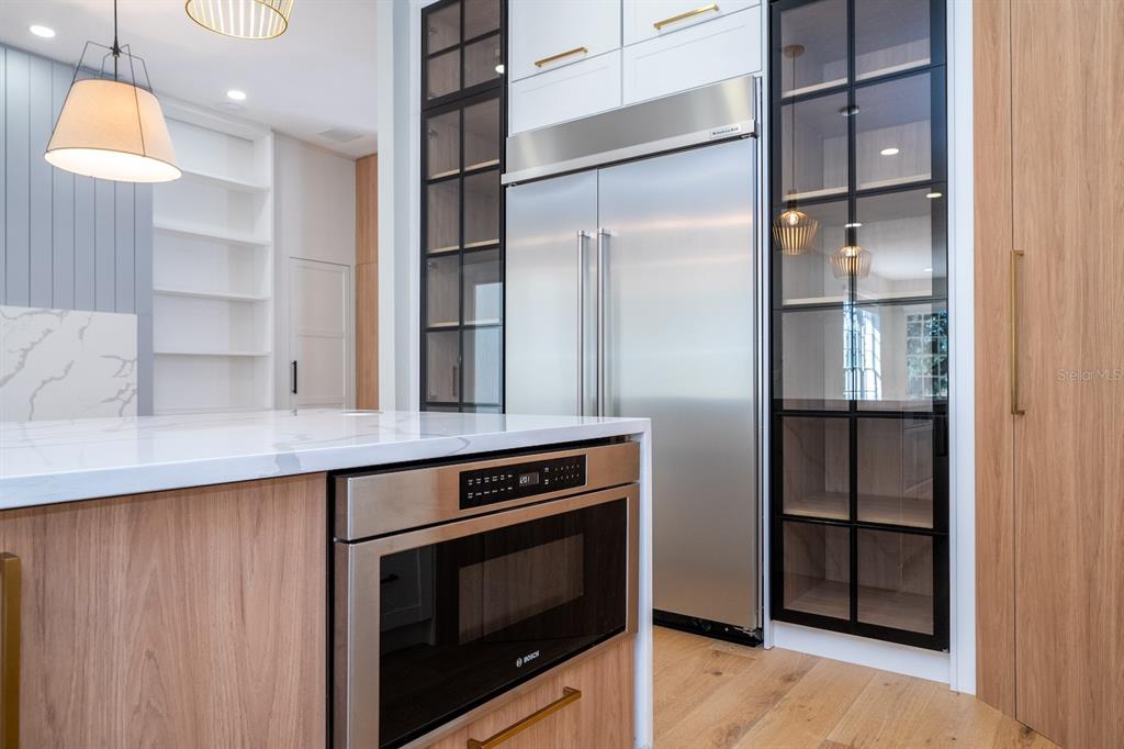 11213 Camden Park Drive Windermere, FL 34786 - Photo 33 of 99 a kitchen with stainless steel appliances granite countertop a refrigerator and a stove top oven
