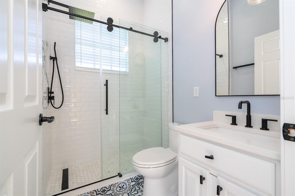 11213 Camden Park Drive Windermere, FL 34786 - Photo 44 of 99 a bathroom with a sink toilet and shower