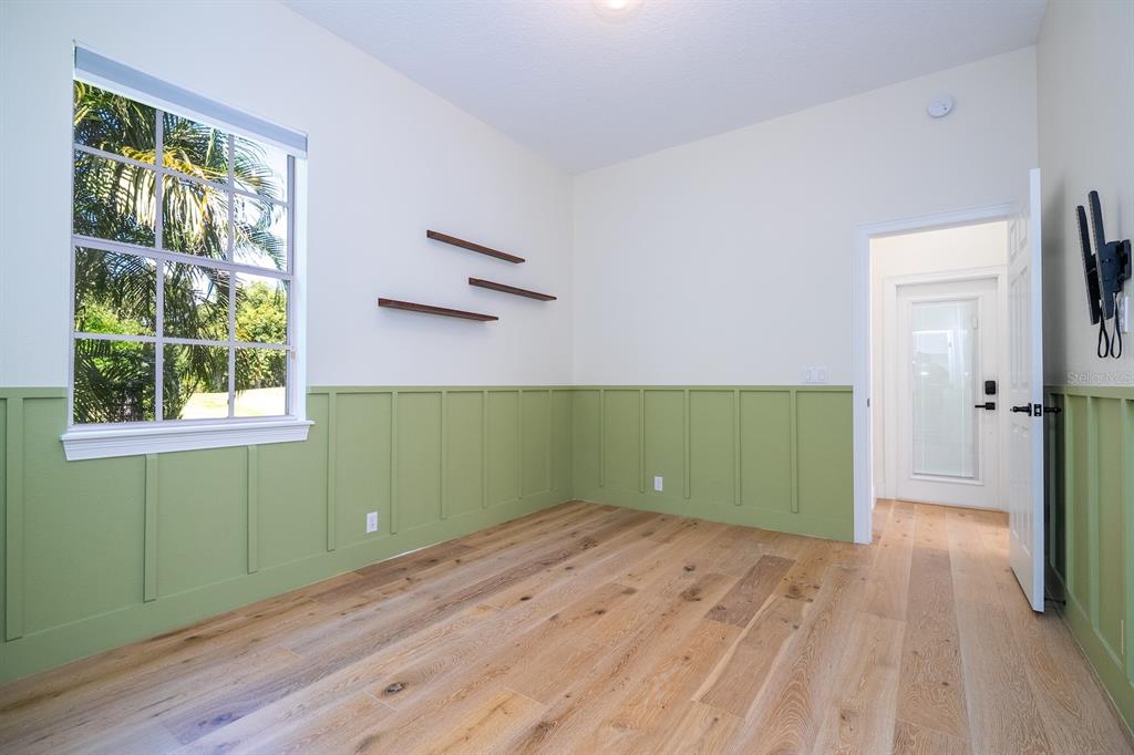 11213 Camden Park Drive Windermere, FL 34786 - Photo 49 of 99 wooden floor in an empty room with a window