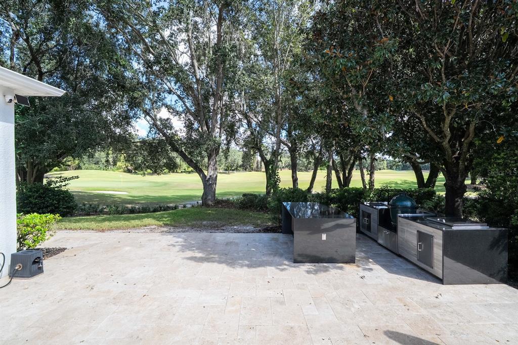 11213 Camden Park Drive Windermere, FL 34786 - Photo 57 of 99 a wooden bench sitting in the middle of a park