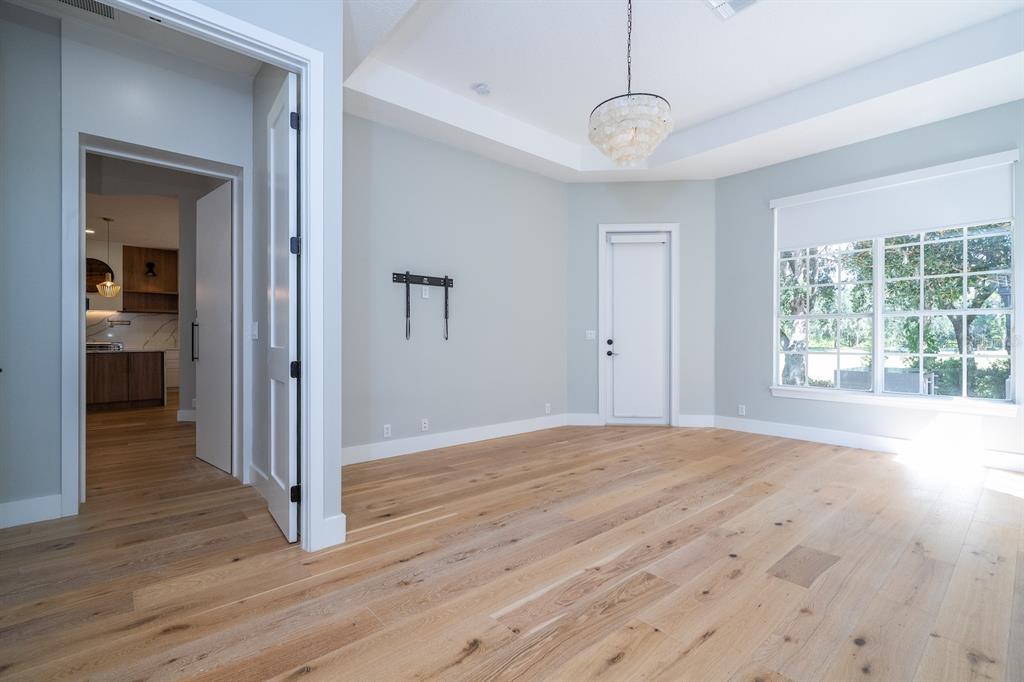11213 Camden Park Drive Windermere, FL 34786 - Photo 62 of 99 a view of empty room with wooden floor and fan