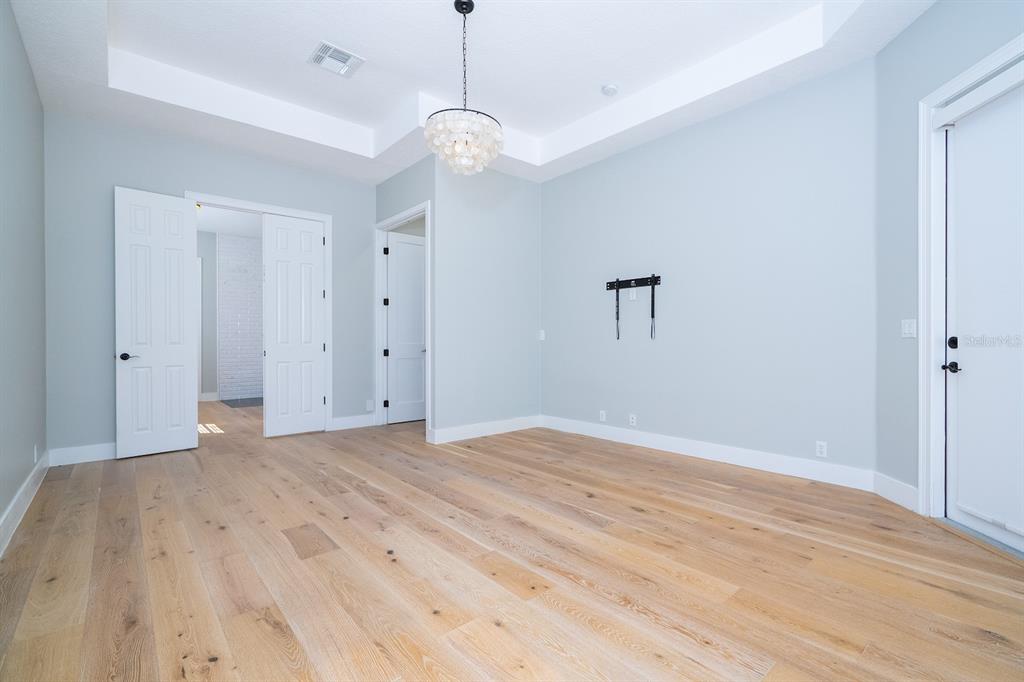 11213 Camden Park Drive Windermere, FL 34786 - Photo 63 of 99 a view of empty room with wooden floor