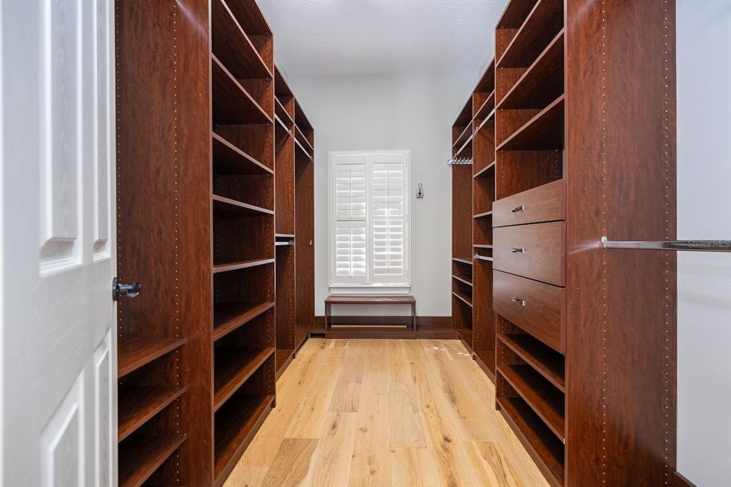 11213 Camden Park Drive Windermere, FL 34786 - Photo 70 of 99 a view of walk in closet with empty racks