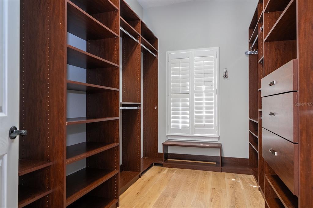11213 Camden Park Drive Windermere, FL 34786 - Photo 71 of 99 a view of walk in closet with empty racks