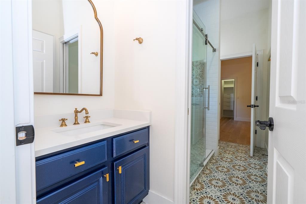 11213 Camden Park Drive Windermere, FL 34786 - Photo 84 of 99 a bathroom with a sink a toilet and shower