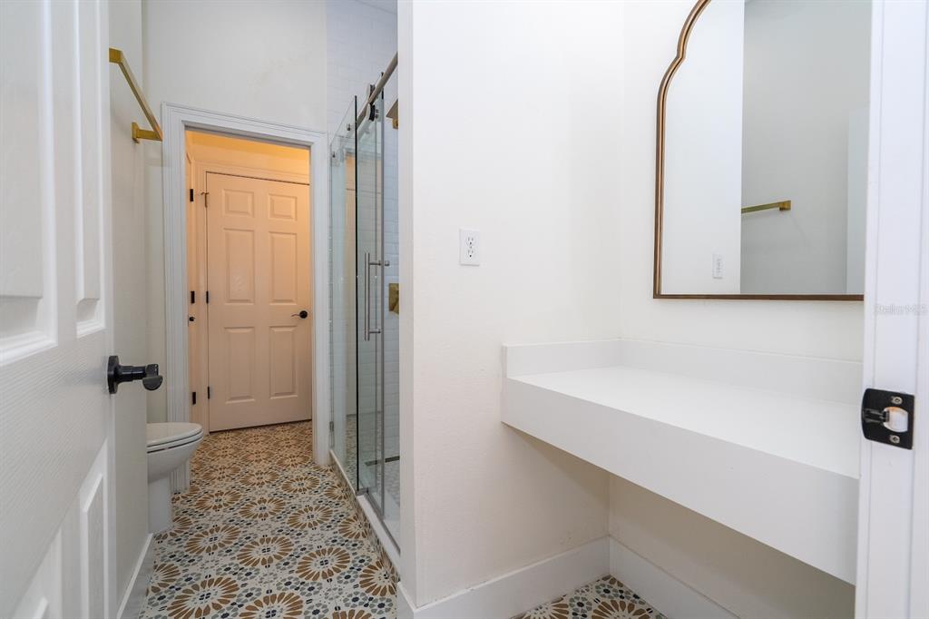 11213 Camden Park Drive Windermere, FL 34786 - Photo 87 of 99 a bathroom with a sink and a shower