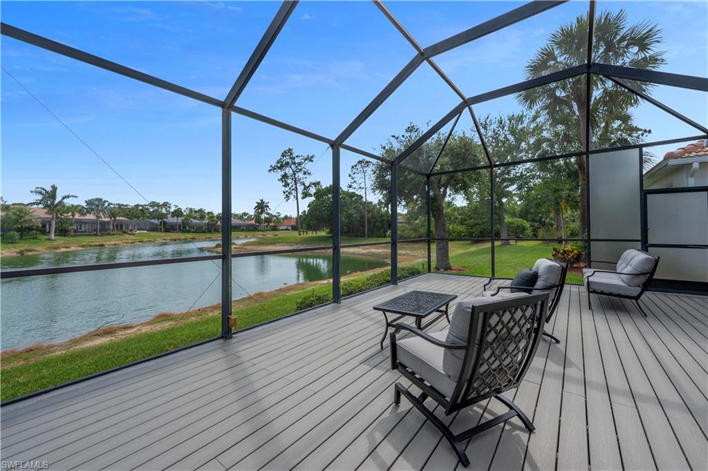 Deck with a water view, an outdoor hangout area, and a lanai