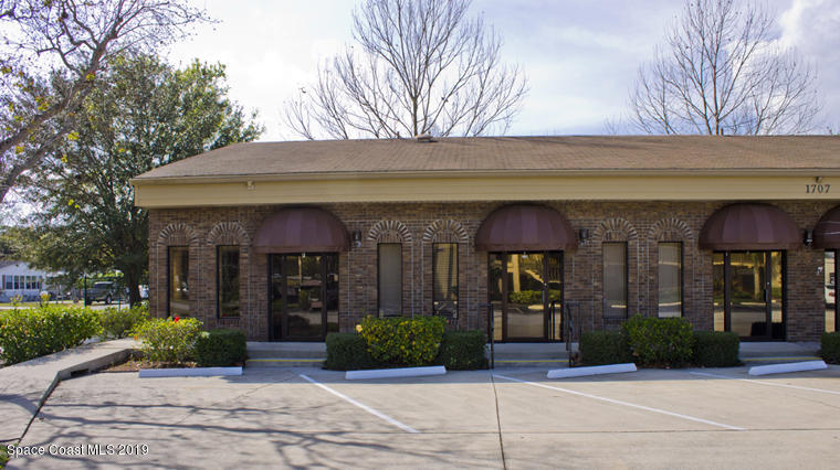 1707 Elm Street, Unit D Rockledge, FL 32955 - Photo 1 of 4 a view of a brick building