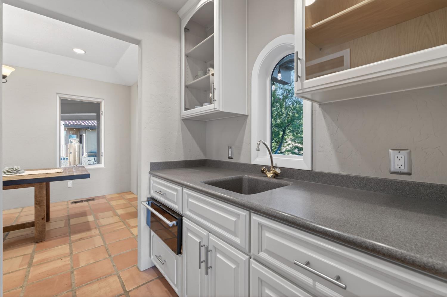 7570 Airola Road Vallecito, CA 95251 - Photo 35 of 90 a kitchen with a sink and cabinets