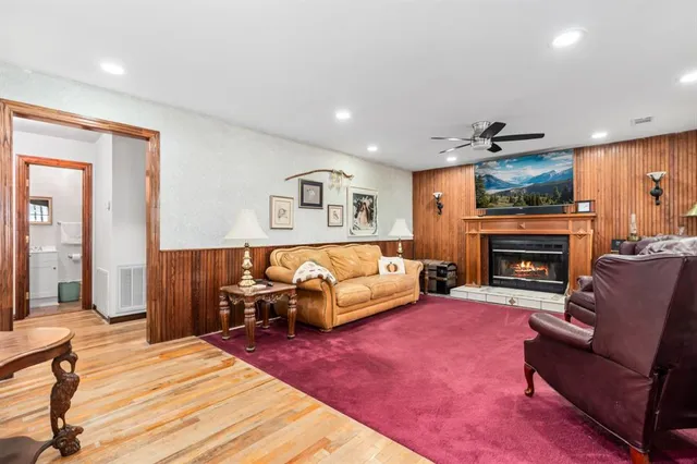 a bedroom with furniture fireplace and window