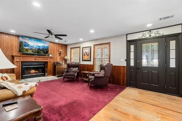 a living room with furniture and a fireplace