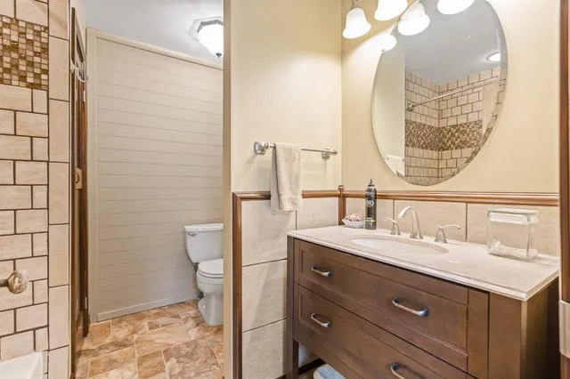 a bathroom with a toilet and sink