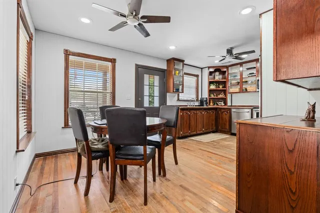 a view of a dining room with furniture and a window
