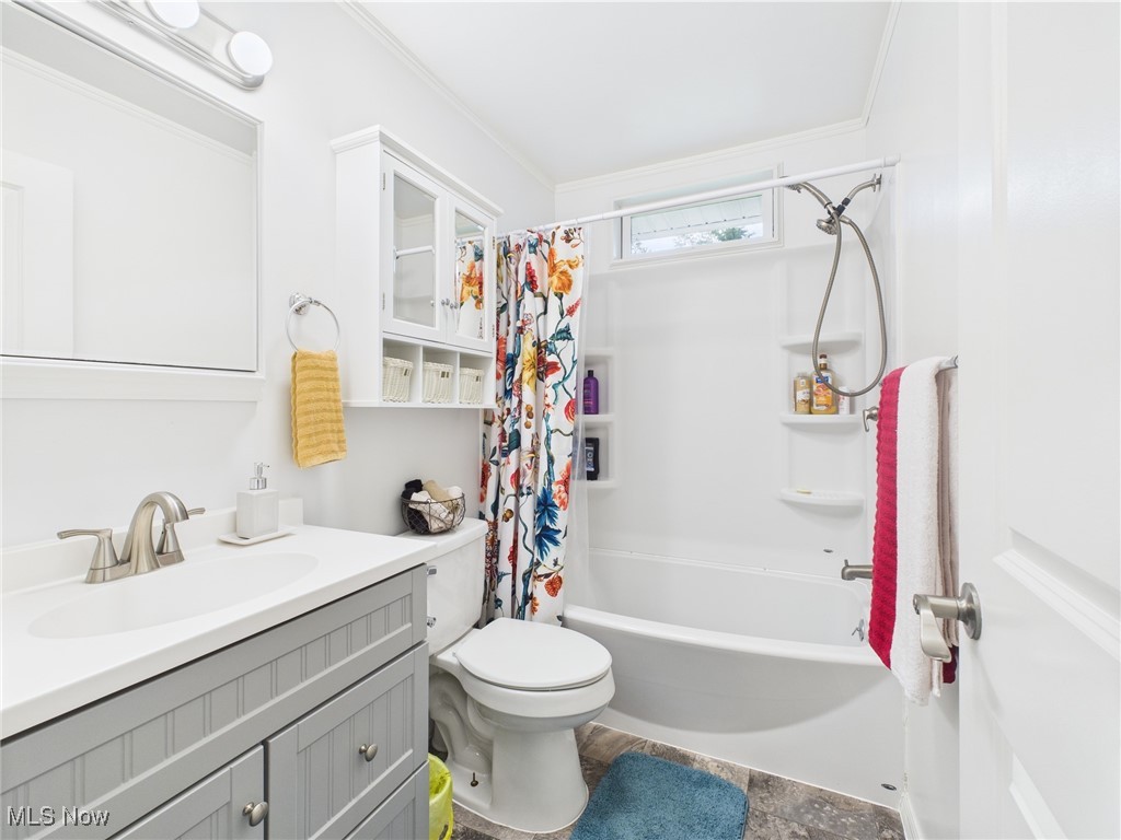 326 Highway 7 Powhatan Point, OH 43942 - Photo 11 of 32 Full bathroom featuring vanity, shower / bath combination with curtain, ornamental molding, and toilet