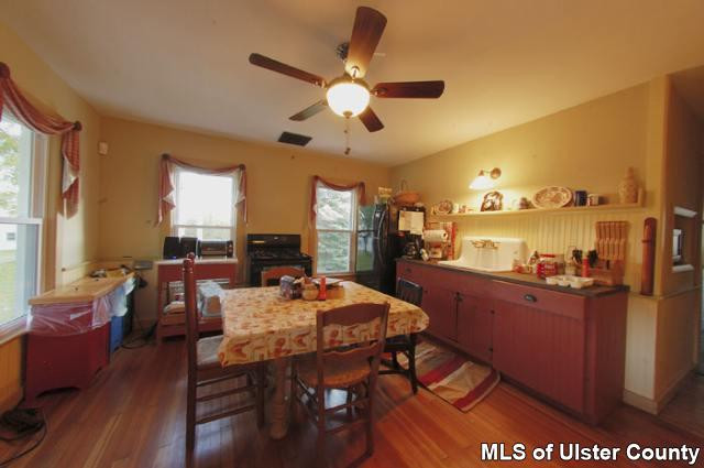 663 Wheat Hill Road Sidney Center, NY 13839 - Photo 2 of 4 a view of a dining room with furniture and window