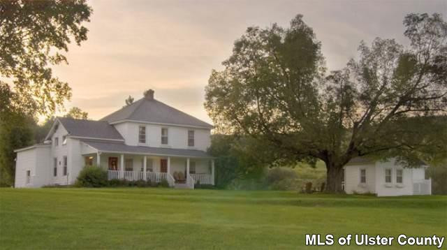 663 Wheat Hill Road Sidney Center, NY 13839 - Photo 4 of 4 a front view of a house with a garden