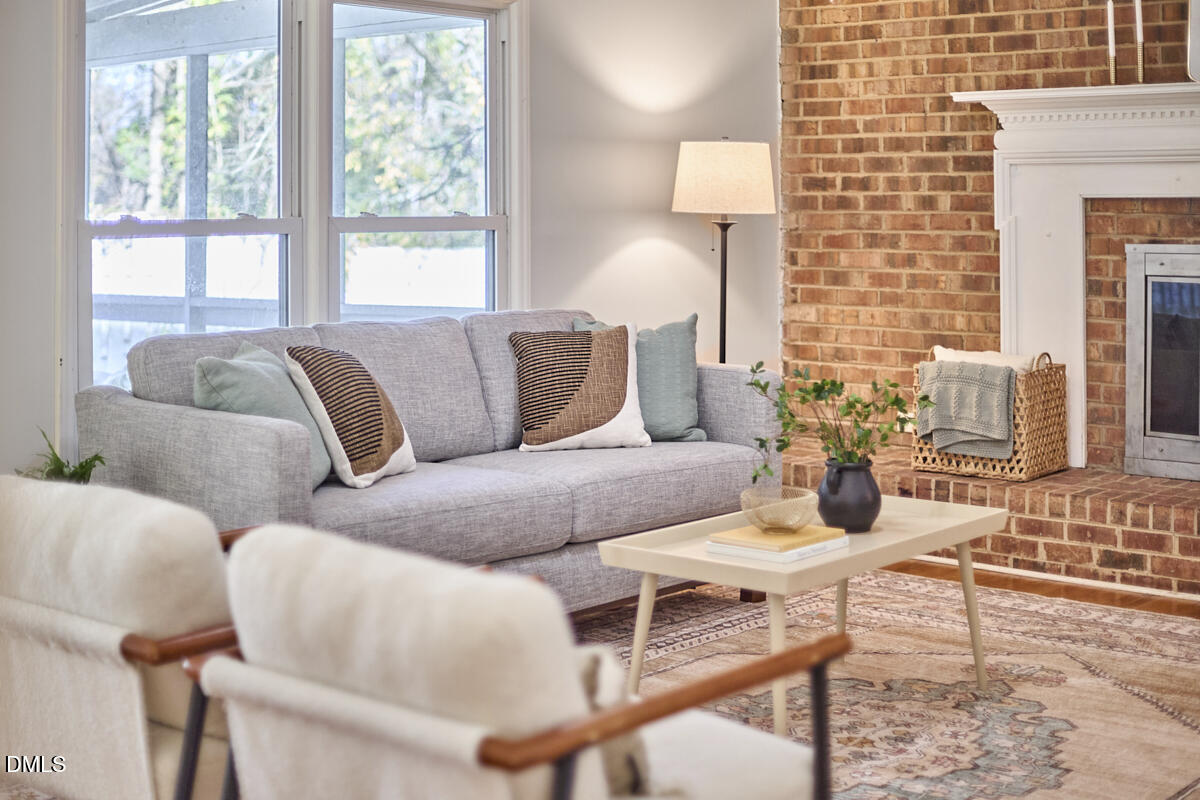 1918 Peppertree Street Durham, NC 27705 - Photo 12 of 45 a living room with furniture and a large window