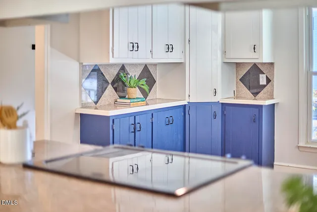 a kitchen with cabinets a sink and a stove