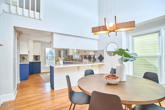 a dining room with furniture and wooden floor