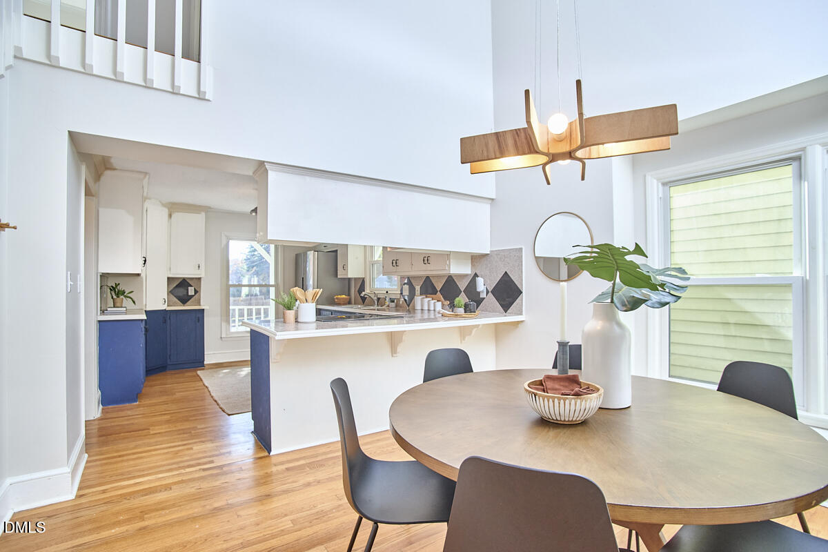 1918 Peppertree Street Durham, NC 27705 - Photo 19 of 45 a dining room with furniture and wooden floor