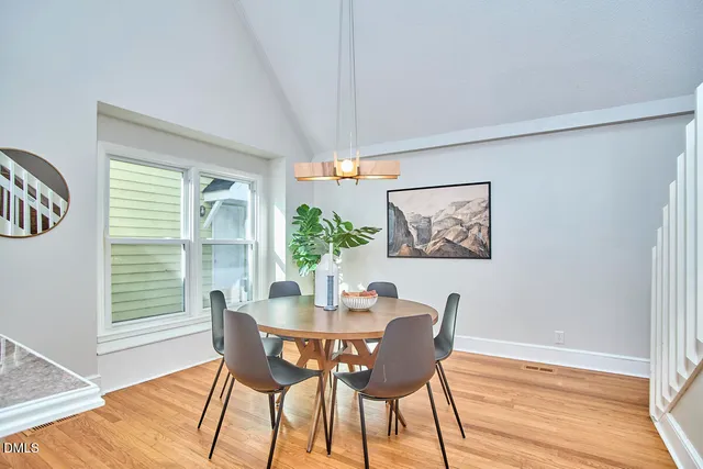 a dining room with furniture and window