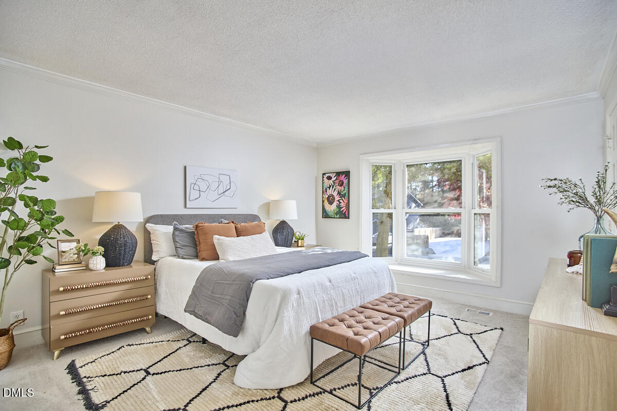 1918 Peppertree Street Durham, NC 27705 - Photo 24 of 45 a bedroom with a bed and a window