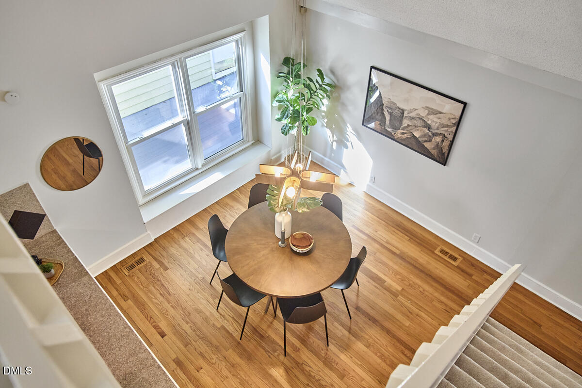 1918 Peppertree Street Durham, NC 27705 - Photo 38 of 45 a view of a dining room with furniture and wooden floor