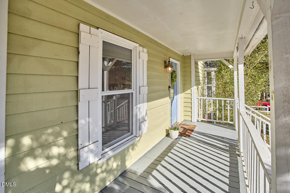 1918 Peppertree Street Durham, NC 27705 - Photo 41 of 45 a view of a balcony with wooden floor and door