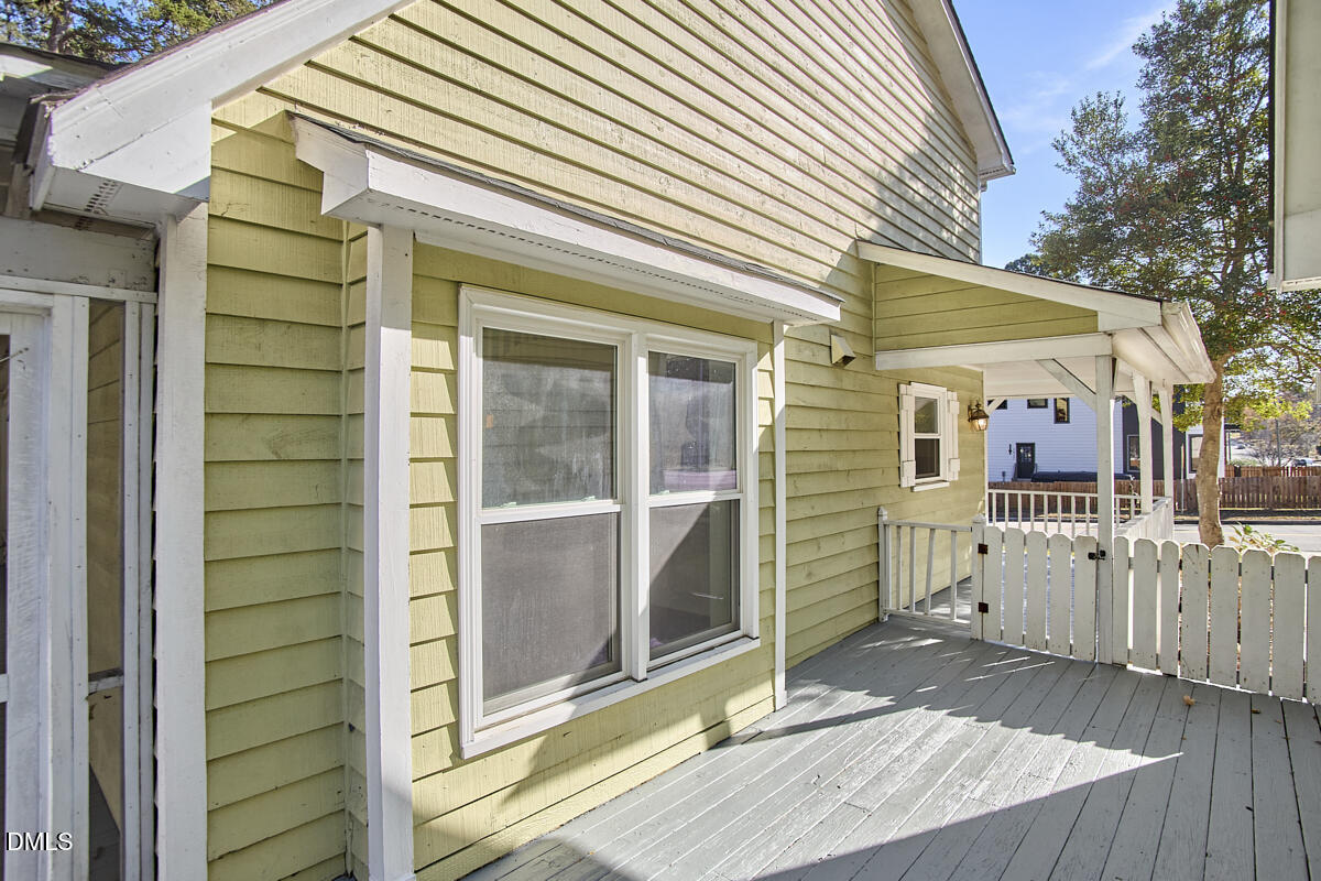 1918 Peppertree Street Durham, NC 27705 - Photo 44 of 45 a view of a house with a small yard and wooden floor and fence