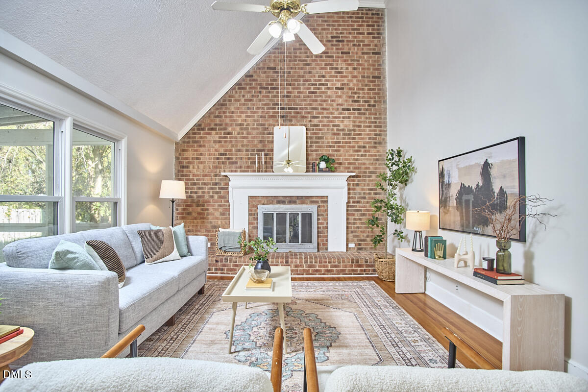 1918 Peppertree Street Durham, NC 27705 - Photo 6 of 45 a living room with furniture and a fireplace