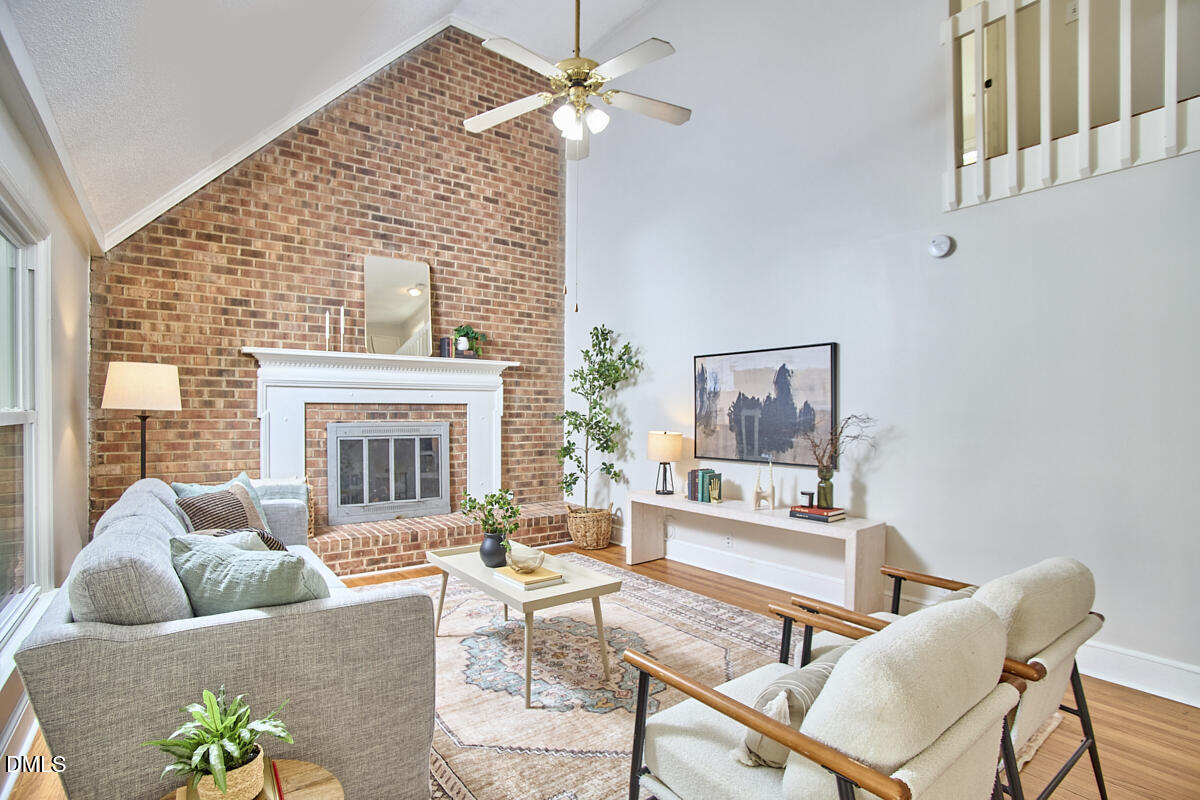 1918 Peppertree Street Durham, NC 27705 - Photo 8 of 45 a living room with furniture and a fireplace