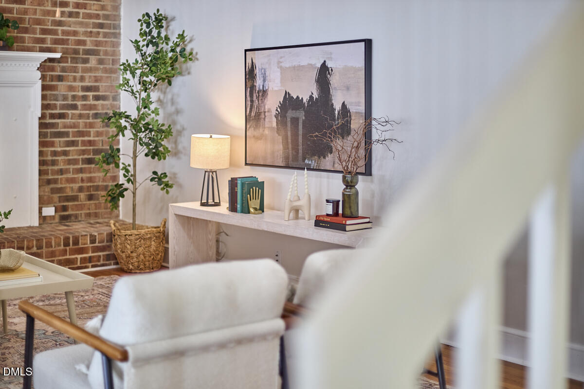 1918 Peppertree Street Durham, NC 27705 - Photo 10 of 45 a living room with furniture and a potted plant