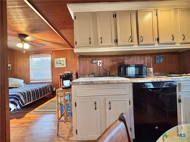 a dining room with furniture and glass door