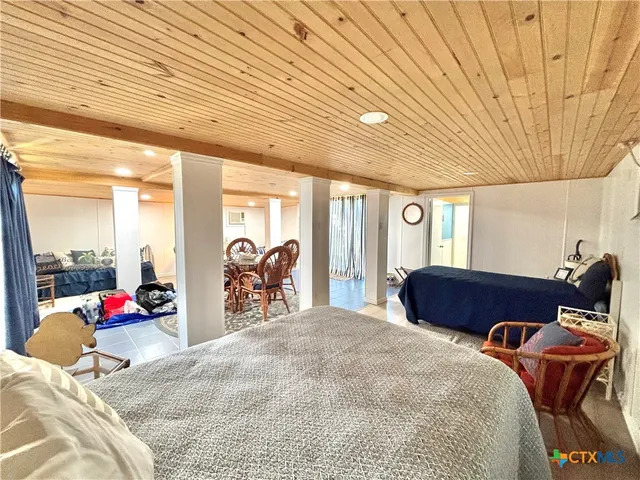a view of a livingroom with furniture and staircase
