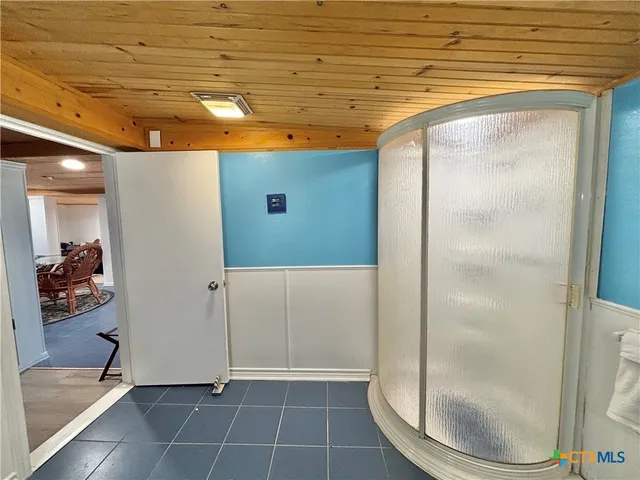a bathroom with a sink and a shower